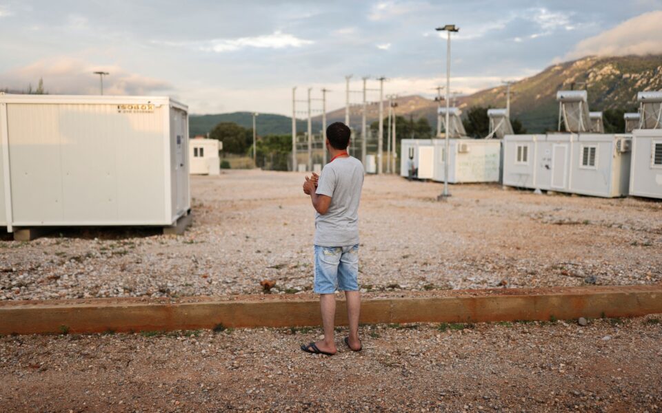 A survivor of a deadly migrant shipwreck at open sea off Greece, stands inside a reception and identification camp in Malakasa, Greece, June 17, 2023. REUTERS/Stelios Misinas