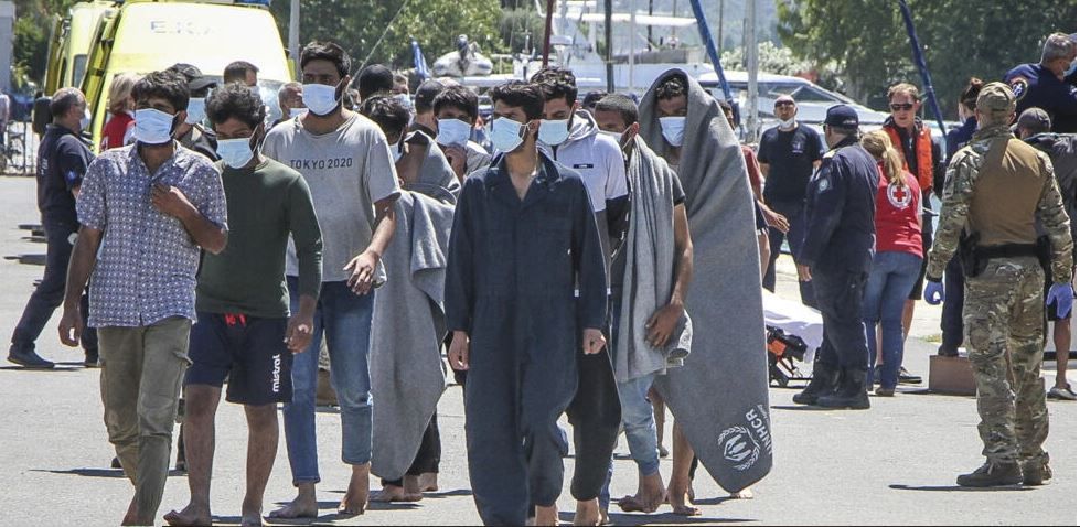 Photo 1: Survivors arrive at Kalamata Port following the capsizing of a boat carrying dozens of migrants off the Greek coast on June 14, 2023.© Eurokinissi/ AFP